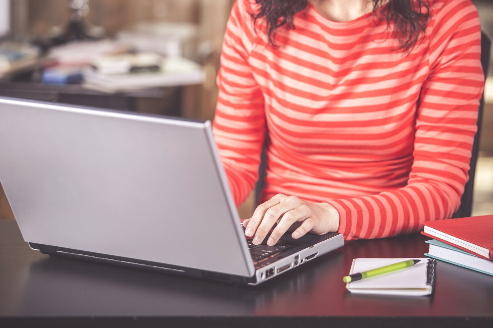 Close up view of a woman using her laptop